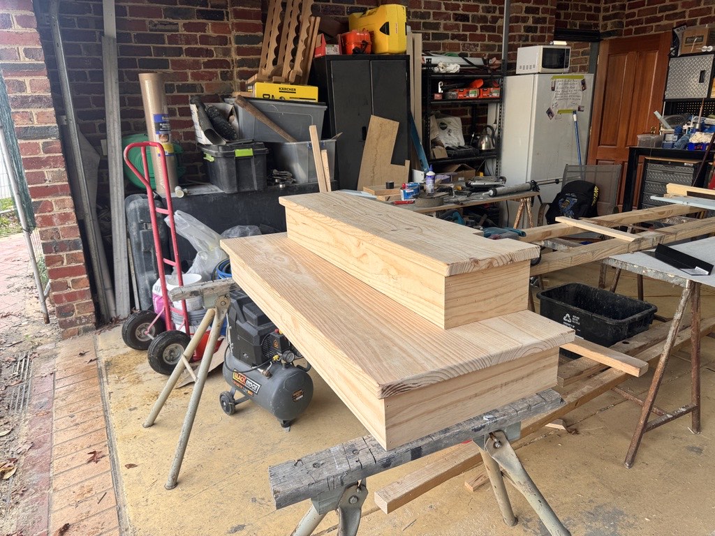 Solid timber stair treads built up in the workshop before install
